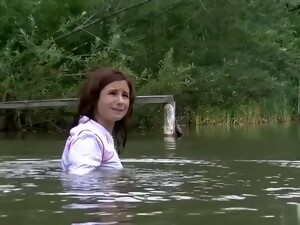 Girl With Fully Clothes Swims In Lake